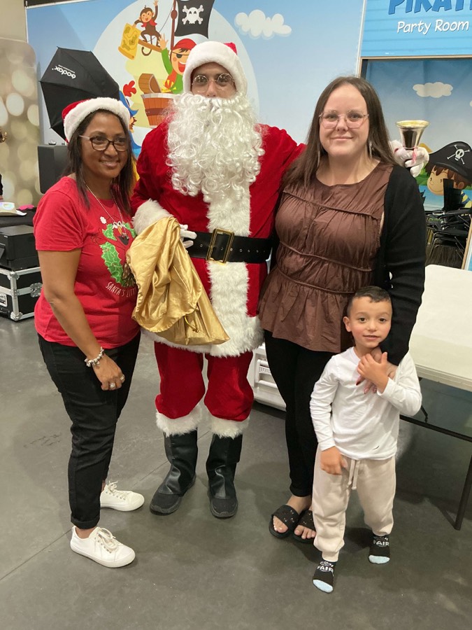 Families meeting Santa at a Happy Sprouts Christmas celebration